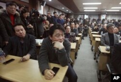South Korean owners who run factories in the suspended inter-Korean Kaesong Industrial Complex, attend an emergency meeting held by the council of South Korean companies operating in the industrial park, in Seoul, S. Korea, Feb. 12, 2016.