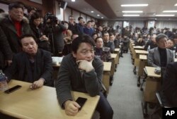 South Korean owners who run factories in the suspended inter-Korean Kaesong Industrial Complex, attend an emergency meeting held by the council of South Korean companies operating in the industrial park, in Seoul, South Korea, Friday, Feb. 12, 2016.