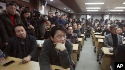 South Korean owners who run factories in the suspended inter-Korean Kaesong Industrial Complex, attend an emergency meeting held by the council of South Korean companies operating in the industrial park, in Seoul, South Korea, Friday, Feb. 12, 2016.