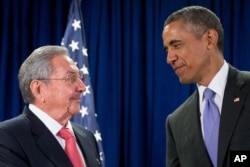 FILE - Cuban President Raul Castro, left, and U.S. President Barack Obama talks before a bilateral meeting at the United Nations headquarters in New York, Sept. 29, 2015.
