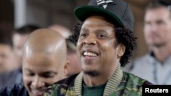 FILE - Recording artist Jay-Z attends a game at the Los Angeles Memorial Coliseum, Nov. 19, 2018. 
