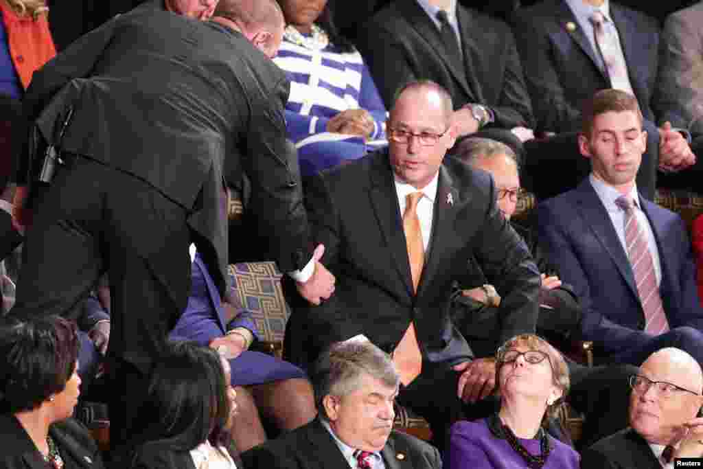 Fred Guttenberg, father of Parkland school shooting victim Jaime Guttenberg, is ejected after shouting during U.S. President Donald Trump&#39;s State of the Union address to a joint session of the Congress in the House Chamber of the U.S. Capitol in Washington, Feb. 4, 2020.