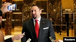 FILE - Communications adviser Jason Miller speaks to the media in the lobby of Trump Tower in New York, Nov. 16, 2016.