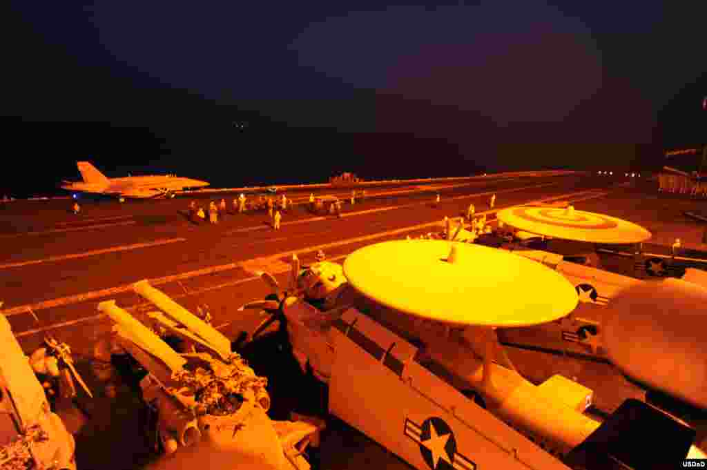 An F/A-18C Hornet, attached to Strike Fighter Squadron prepares to launch from the flight deck of the aircraft carrier USS George H.W. Bush to conduct strike missions against ISIL targets. George H.W. Bush is supporting maritime security operations and theater security cooperation efforts in the U.S. 5th Fleet area of responsibility, Arabian Gulf, Sept. 23, 2014. (U.S. Navy photo by Mass Communication Specialist 3rd Class Robert Burck/Released) 