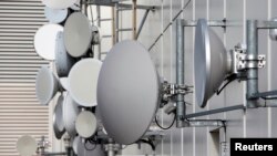 Various types of directional antennas are pictured on the roof of a skyscraper in Berlin, November 5, 2013. Germany's Foreign Ministry said on Tuesday it had asked the British ambassador to come and discuss a report that Britain was operating a covert spy