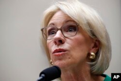 FILE - Education Secretary Betsy DeVos testifies at a House Committee on Education and the Workforce on Capitol Hill in Washington, May 22, 2018.