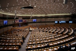 FILE - European Parliament members attend a plenary session at the European Parliament in Brussels, Belgium, Jan. 31, 2019.