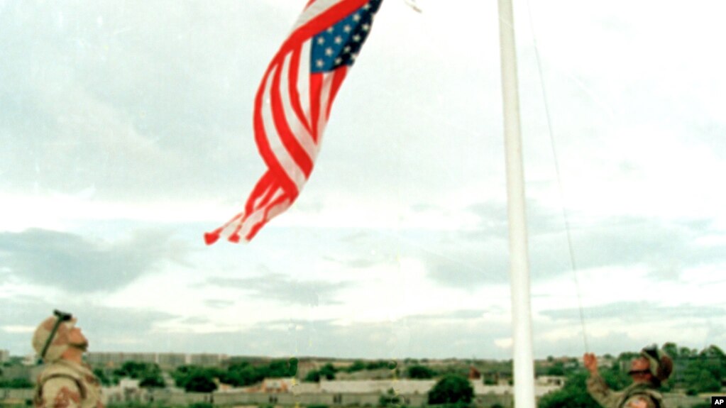 FILE - U.S. Marines raise the American flag over the reclaimed U.S. Embassy in Mogadishu.