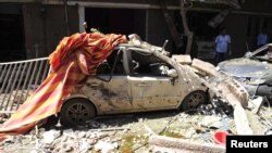Jedan od automobila uništenih u današnjoj eksploziji u jugoistočnoj četvrti Damaska, Džaramana
