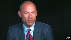 FILE - In this image from video, Michael Avenatti, attorney and spokesperson for adult film star Stormy Daniels, listens to a reporter's question during an interview in New York, March 21, 2018.