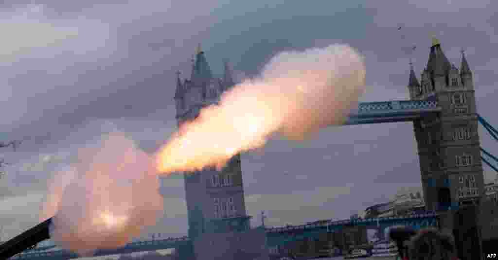 Members of Honorable Artillery Company and the City of London&rsquo;s Territorial Army Regiment, fire a 62-gun salute at the Tower of London in honor of the 61st anniversary of Britain&#39;s Queen Elizabeth II&#39;s accession to the throne.