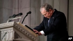 Former President George W. Bush speaks at the State Funeral for his father, former President George H.W. Bush, at the National Cathedral, Wednesday, Dec. 5, 2018, in Washington.(AP Photo/Alex Brandon, Pool)