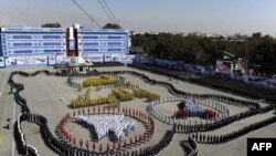 A handout picture released by the official website of Iran's supreme leader, Ayatollah Ali Khamenei, shows a military parade during his visit to the Military College of Tehran on October 5, 2013.