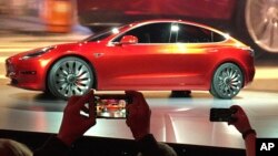 Tesla Motors unveils the new lower-priced Model 3 sedan at the Tesla Motors design studio in Hawthorne, California, March 31, 2016. Electric car maker Tesla said, July 3, 2017, that its Model 3 car will go on sale on Friday.
