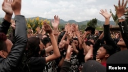 Punk community members dance during a punk music festival in Bandung, Indonesia West Java province, March 23, 2017. Picture taken March 23, 2017.