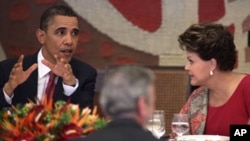 U.S. President Barack Obama, left, speaks during lunch with Brazil's President Dilma Rousseff at Itamaraty Palace in Brasilia, Brazil, Saturday March 19, 2011.
