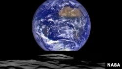 FILE - This NASA image released Dec. 18, 2015, shows Earth from a spacecraft's vantage point in orbit around the moon. Scientists have identified more than 200 minerals on Earth created as side effects of human industries, and argue that mankind's imprint on the Earth is so deep that it marks a new geological epoch.