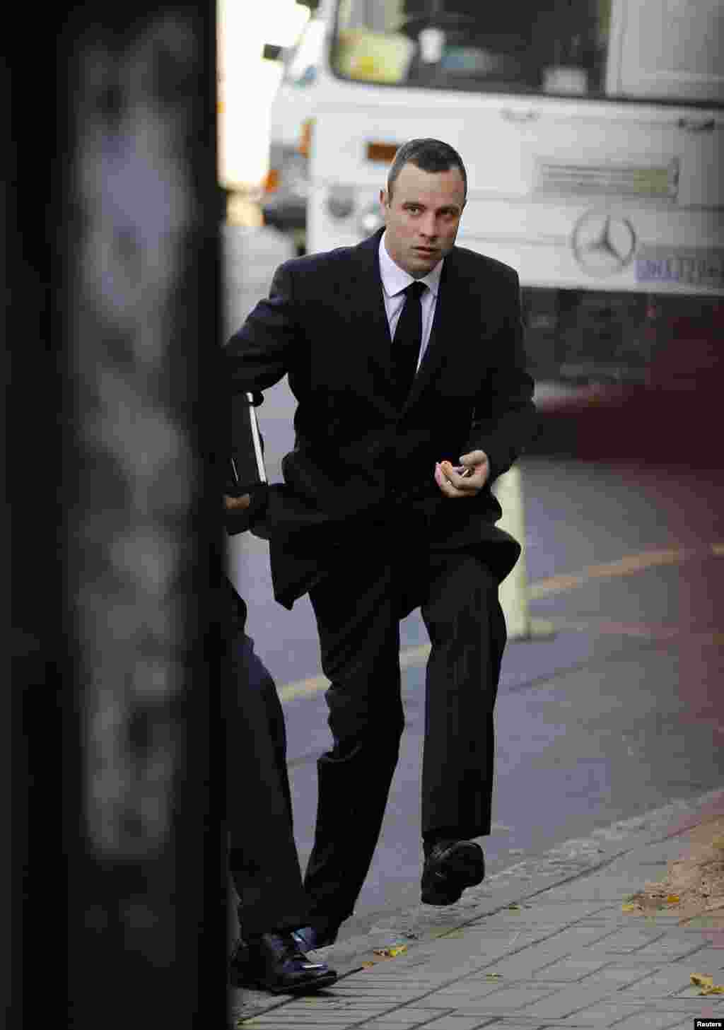 Olympic and Paralympic track star Oscar Pistorius arrives for his trial, at the North Gauteng High Court in Pretoria, May 20, 2014.