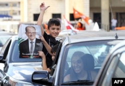 Lebanese people take to the streets in Jdeideh, on the northern outskirts of the capital Beirut, to celebrate the election of former general Michel Aoun as president, Oct. 31, 2016.