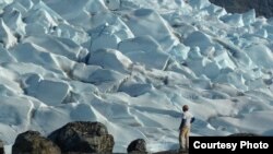 University of Wisconsin geologist Anders Carlson looking at an ice margin in south Greenland that is changing from being marine based to land based and thus slowing down and becoming more predictable. (Photo: Rob Hatfield, Oregon State University) 