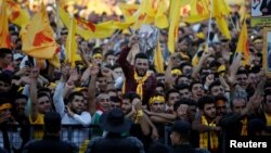 Supporters of the former president of Iraq's Kurdistan region, Masoud Barzani, rally ahead of regional elections, in Irbil, Iraq, Sept. 25, 2018.