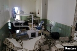 FILE - Damage at a hospital is seen after an airstrike in Deir al-Sharqi village in Idlib province, Syria, April 27, 2017.