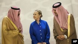Saudi Foreign Minister Prince Saud Al-Faisal, right, US Secretary of State Hillary Clinton and Kuwaiti Foreign Minister Sheikh Sabah Khaled al-Hamad Al-Sabah chat before a US- Gulf Cooperation Council forum at the Gulf Cooperation Council Secretariat in R