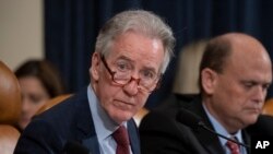 FILE - House Ways and Means Committee Chairman Richard Neal, D-Mass., who is demanding President Donald Trump's tax returns for six years, is joined at right by Rep. Tom Reed, R-N.Y., at a hearing on taxpayer noncompliance on Capitol Hill in Washington, May 9, 2019. 