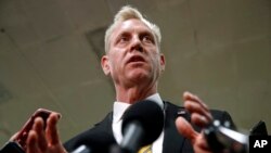 Acting Defense Secretary Patrick Shanahan speaks to reporters after a classified briefing for members of Congress on Iran, May 21, 2019, on Capitol Hill in Washington.