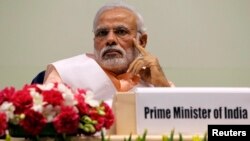 India's Prime Minister Narendra Modi attends an event organized by the Christian community to celebrate the beatification of two Indians by Pope Francis late last year, in New Delhi, Feb. 17, 2015. 