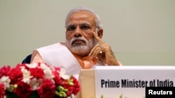 FILE - India's Prime Minister Narendra Modi attends an event organized by the Christian community to celebrate the beatification of two Indians by Pope Francis late last year, in New Delhi, Feb. 17, 2015. 