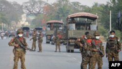 Myanmar soldiers stand guard 