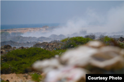 Smoke rises from piles of garbage dumped on Jazeera Beach, in Somalia's capital, Mogadishu. (Courtesy - Jamal Ali)