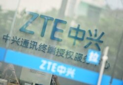 FILE - A sign of ZTE Corp is pictured at its service center in Hangzhou, Zhejiang province, China, May 14, 2018.