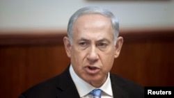 FILE - Israel's Prime Minister Benjamin Netanyahu attends the weekly cabinet meeting in Jerusalem. Oct. 27, 2013.