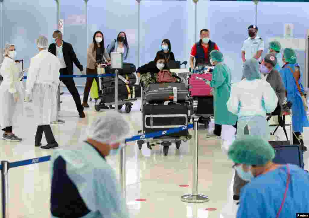 First group of foreign tourists arrive at Suvarnabhumi Airport during the first day of the country&#39;s reopening campaign - a part of the government&#39;s plan to jump start the pandemic-hit tourism sector - in Bangkok, Thailand, Nov. 1, 2021.