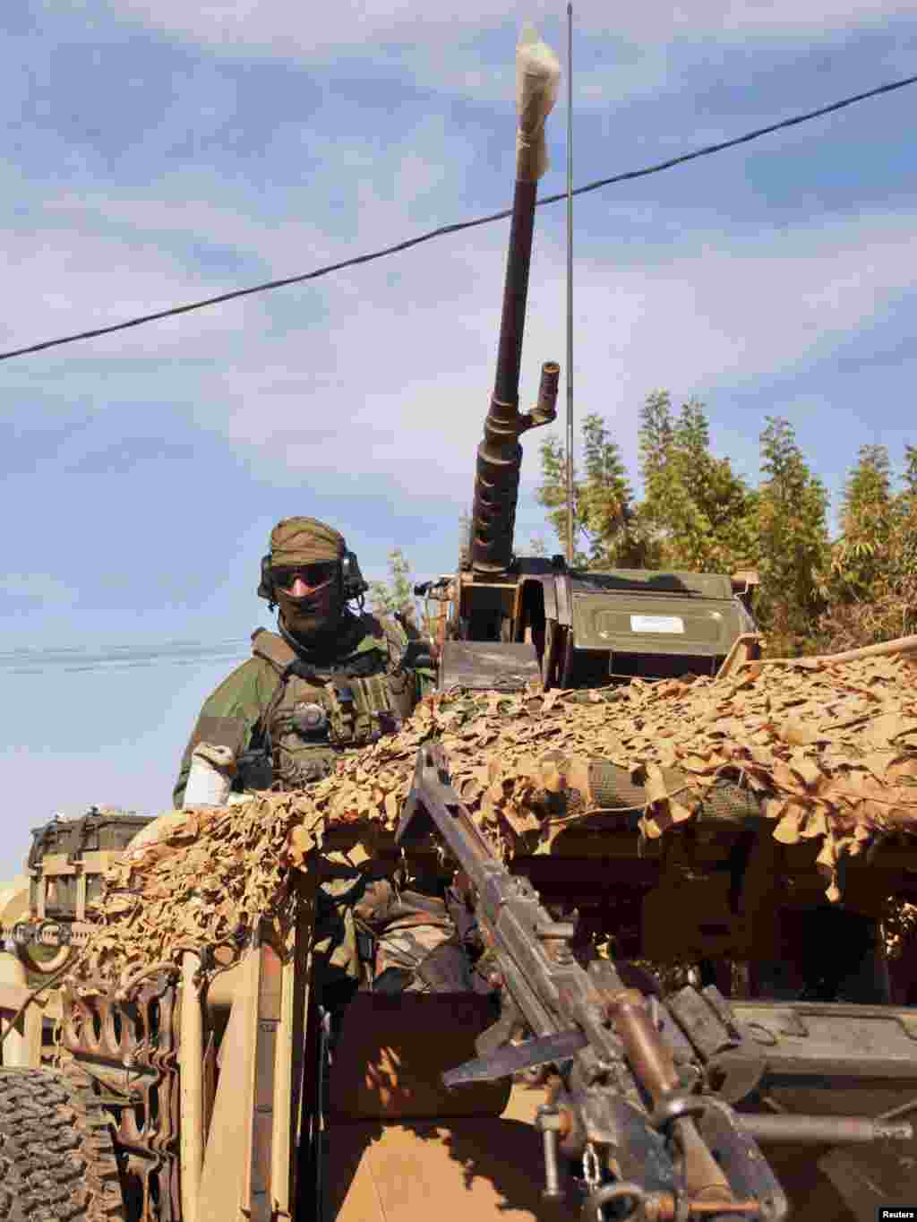 A French elite Special Operations soldier drive through Markala, about 275 kilometers from Bamako, Mali, January 15, 2013.