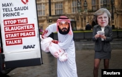 Activists stage a protest timed to coincide with the visit by Saudi Arabia's Crown Prince Mohammed bin Salman outside the Houses of Parliament in London, Britain, March 7, 2018.