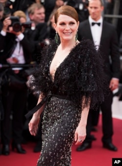 Actress Julianne Moore arrives for the opening ceremony and the screening of the film 'La Tete Haute.'