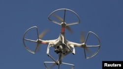 FILE - The use of drones "will help us to define the boundaries of plots of land on the ground with great accuracy," said Samuel Msaki of Tanzania's Ministry of Lands, Housing and Human Settlements Development.
