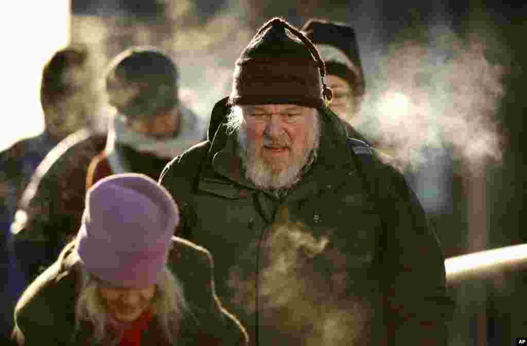 Commuters from Peaks Island arrive in Portland, Maine where the temperature hit low of minus-2 degrees F with a wind chill of minus-25.