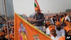 Supporters of Vishwa Hindu Parishad gather during a rally in New Delhi, Dec. 9, 2018. The group gathered thousands of supporters to demand the construction of a Hindu temple on a site where a mosque was attacked, demolished in 1992.