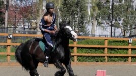 Mikhi Fearon, 17, rides Molly in a riding lesson at Ebony Horse Club, April 18, 2021.