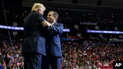 President Donald Trump is greeted by Sen. Ted Cruz, R-Texas, as he arrives for a campaign rally at Houston Toyota Center, Oct. 22, 2018, in Houston, Texas.