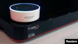 FILE - An Amazon Dot smart speaker is shown at the Dish Network booth during the 2017 CES in Las Vegas, Nevada Jan, 6, 2017.