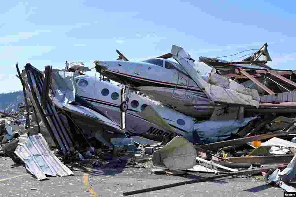 Damaged planes and property are seen at the John C. Tune Airport after a tornado hit Nashville, Tennessee, March 3, 2020.