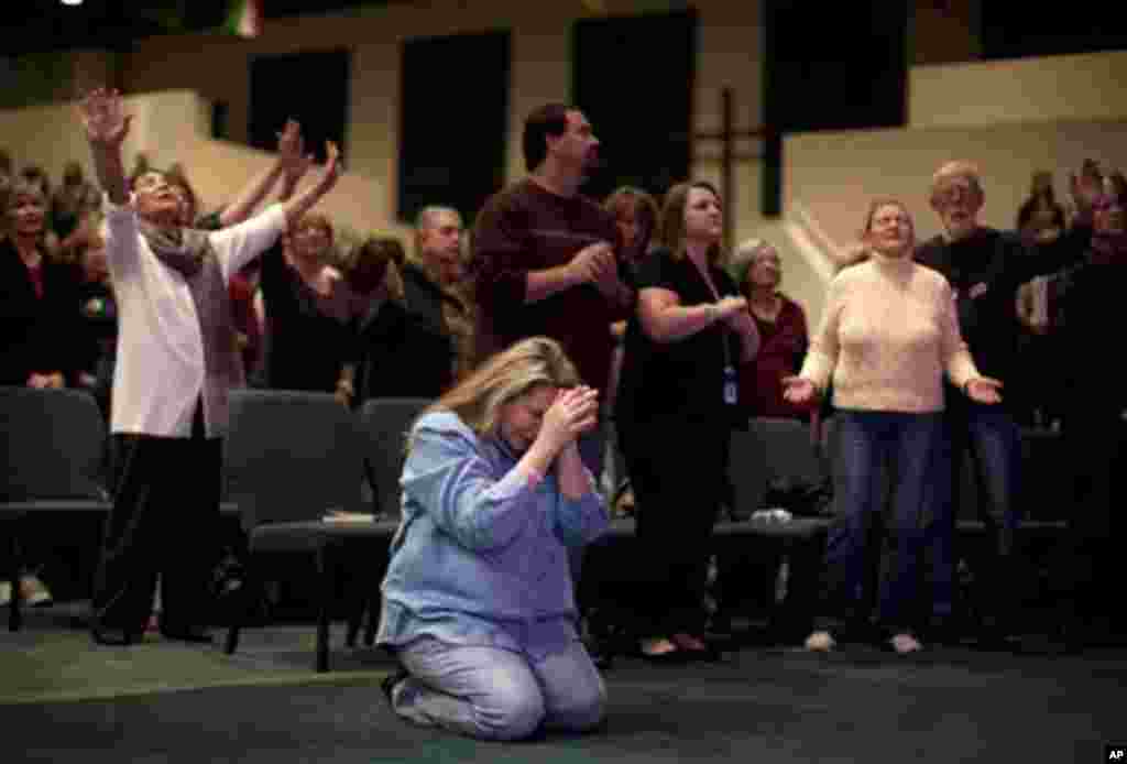 Worshipers pray during a prayer service before a campaign stop by Republican presidential candidate, former House Speaker Newt Gingrich at the International Church of Las Vegas on Friday, Feb. 3, 2012 in Las Vegas, Nev.