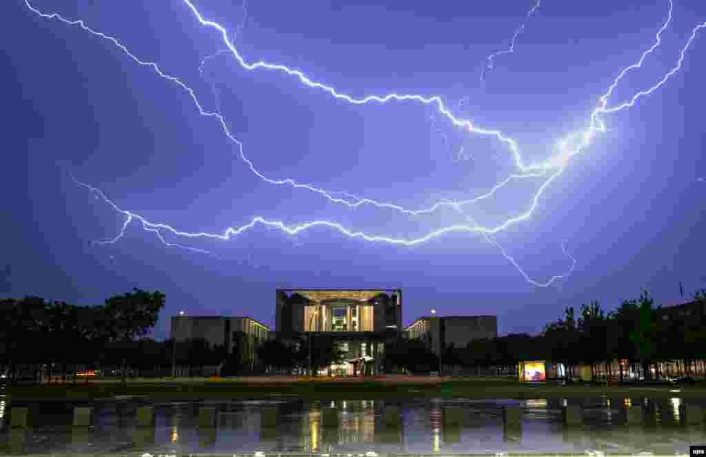A lightning bolt strikes over the German Chancellery in Berlin.