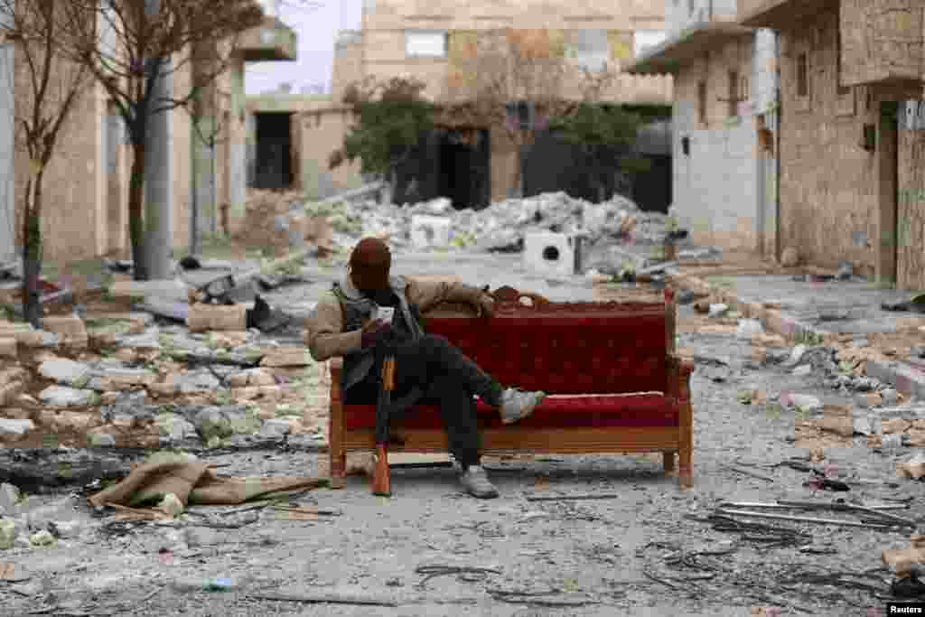 A Turkey-backed Free Syrian Army fighter is seen in the eastern suburbs of al Bab, Syria, Feb. 4, 2018.