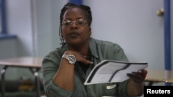 Inmate Aisha Elliott studies during her class at the Taconic Correctional Facility in Bedford Hills, N.Y., April 8, 2016. Taconic inmates are reading classical literature in a Columbia University course, organized by the Hudson Link for Higher Education i